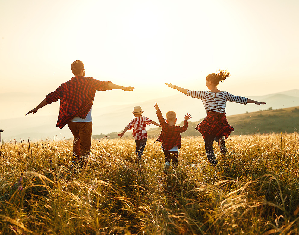 A family playing together in a field.