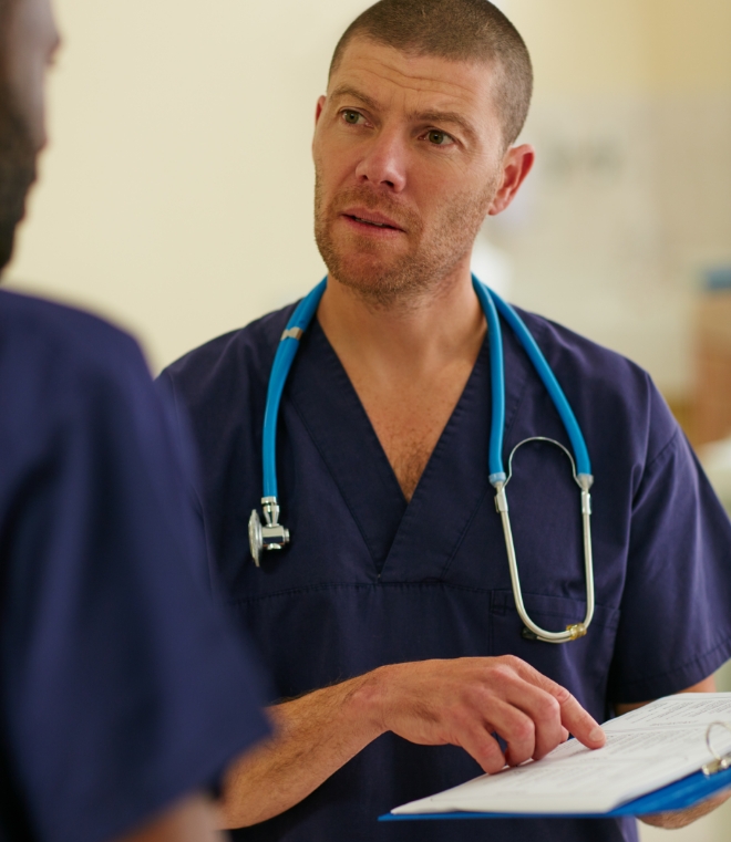  	A nurse using an electronic tablet.