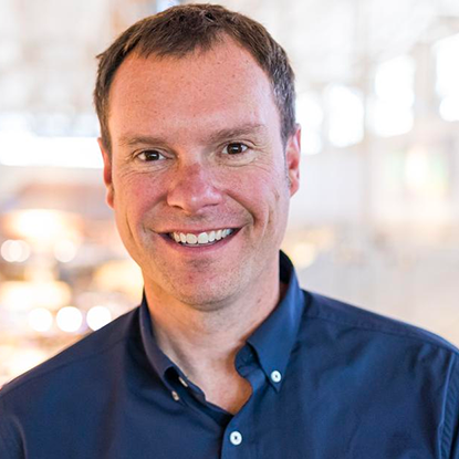 A headshot of President and CEO Greg Dierberg, smiling.