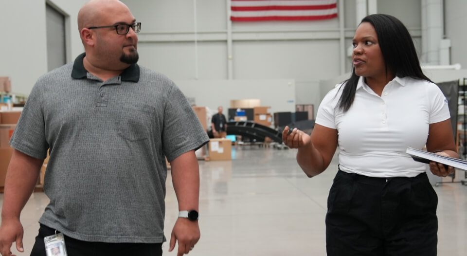 FSI employees talking in an FSI facility.