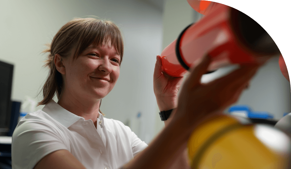 An FSI employee working on FSI simulator equipment.