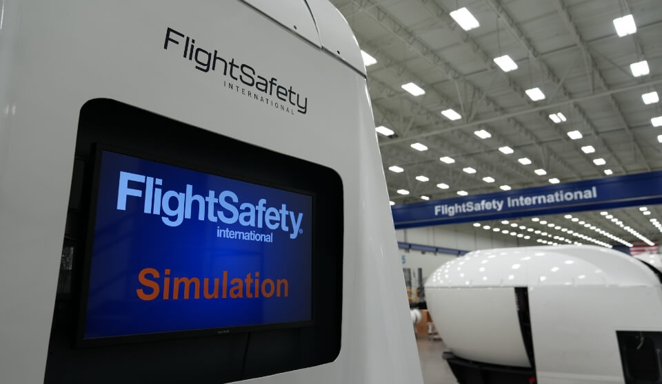 An electronic sign that reads, FlightSafety International Simulation