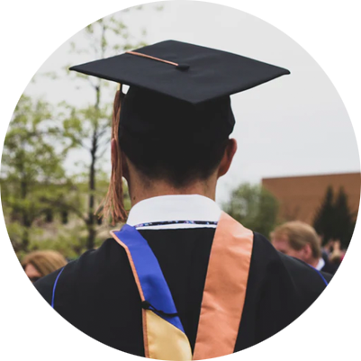 A graduate in black cap and gown.