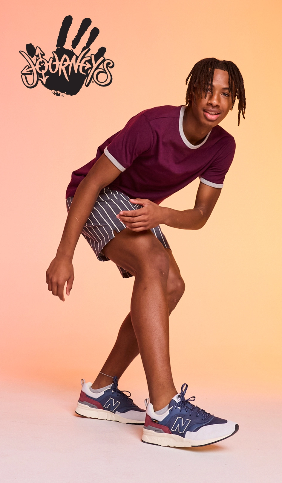 Teenage girl posing in Journeys brand shoes/apparel