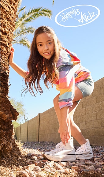 Young girl posing in Journeys Kidâ€™s brand shoes/apparel