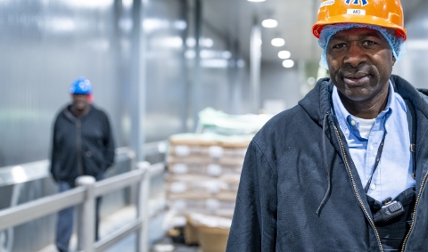  	A Koch Foods employee smiling