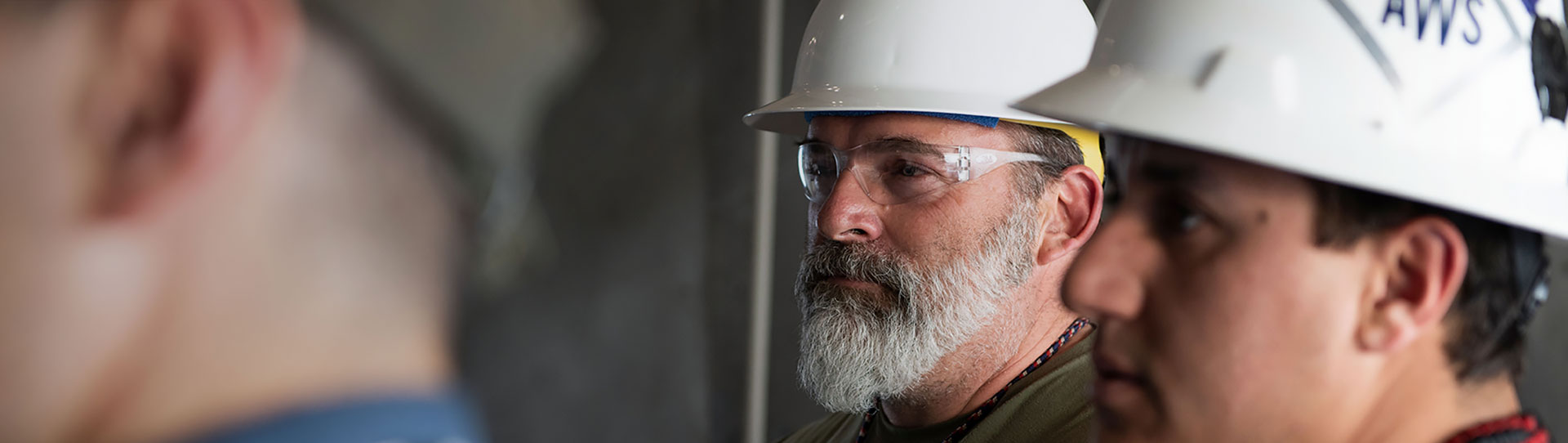 Two craft employees at LANL wearing hard hats