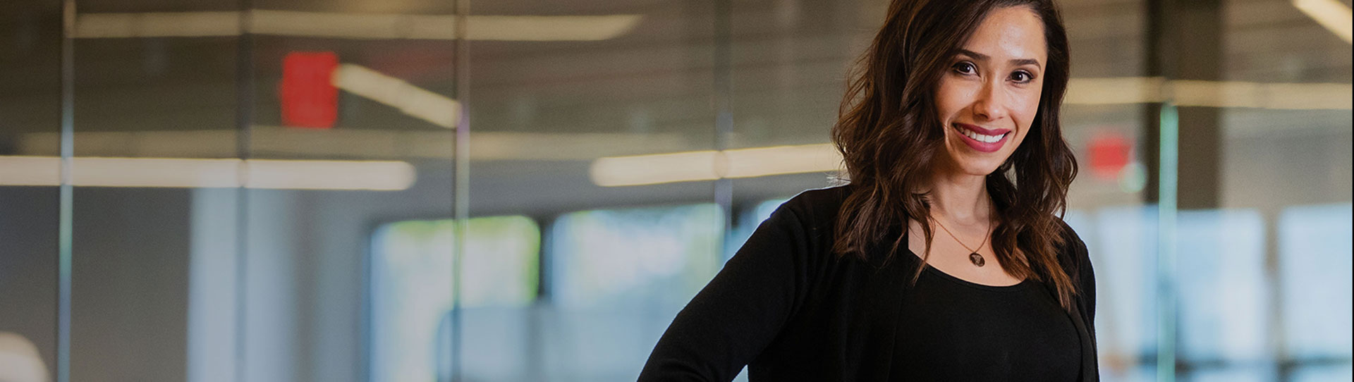 Smiling LANL employee in an office setting