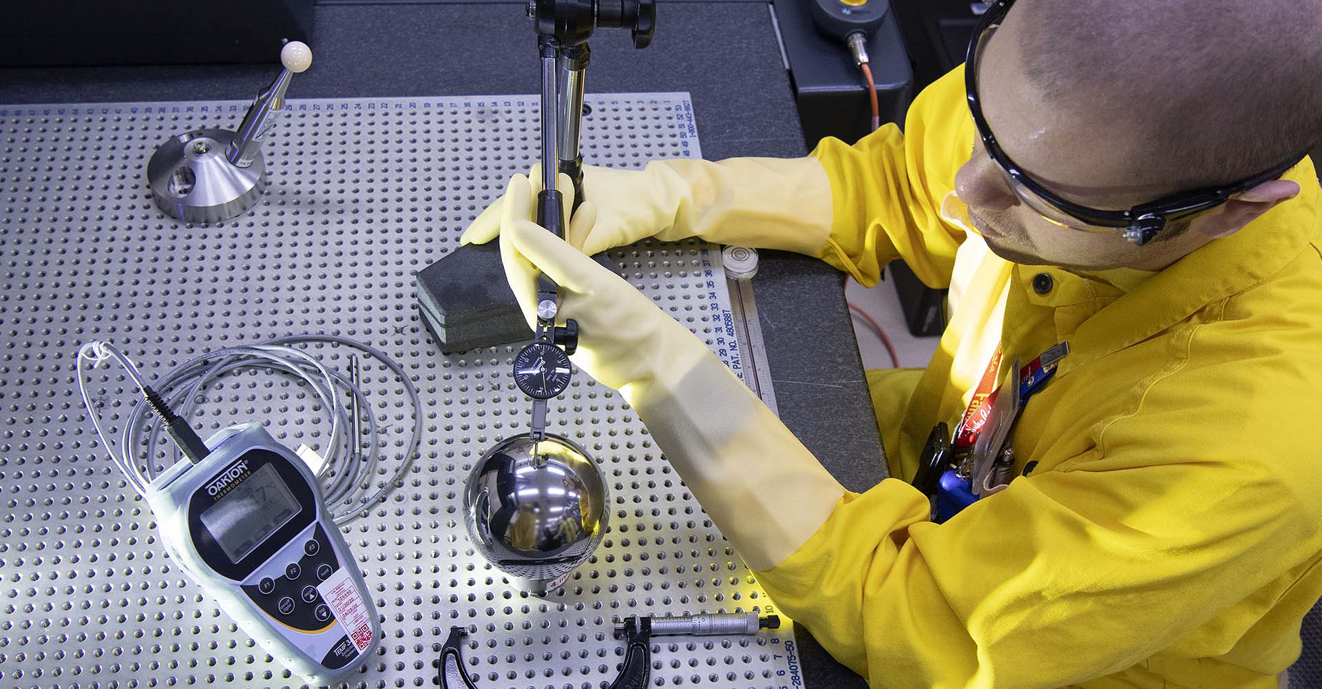 Technician at Plutonium Missions works on a device.