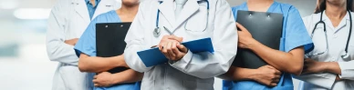 Healthcare professionals holding clipboards and folders