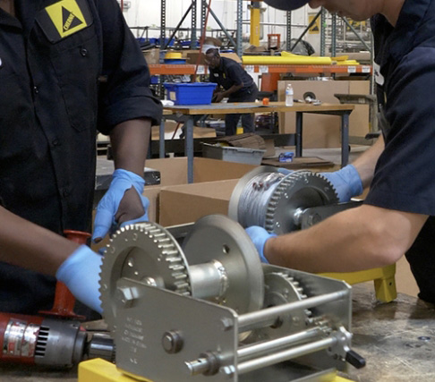 Oatey employees working on products.