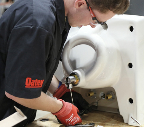 An Oatey employee testing products.