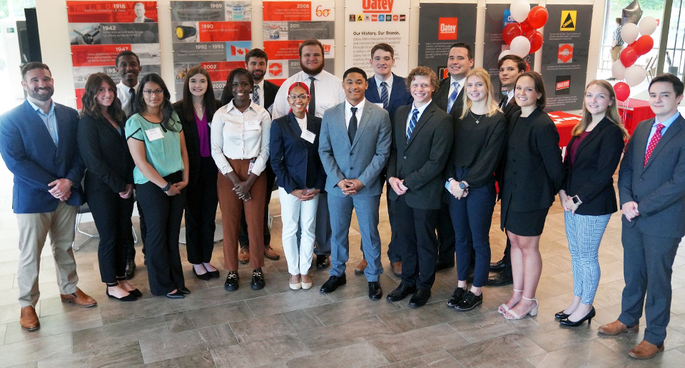 A group of Oatey employees smiling.