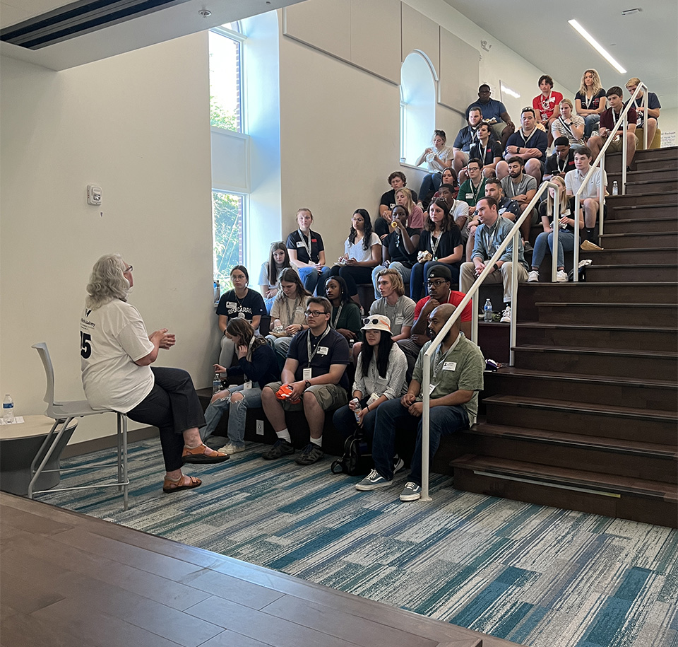 A group of students listening to a presentation.