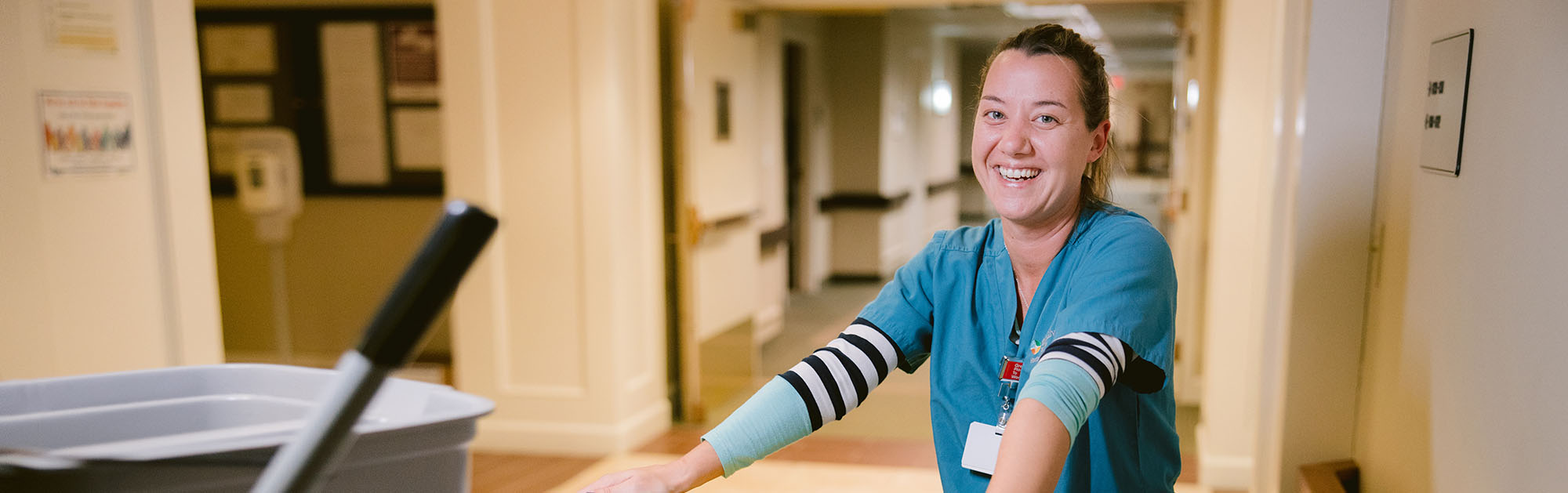 A STNA pauses to smile during her busy workday.