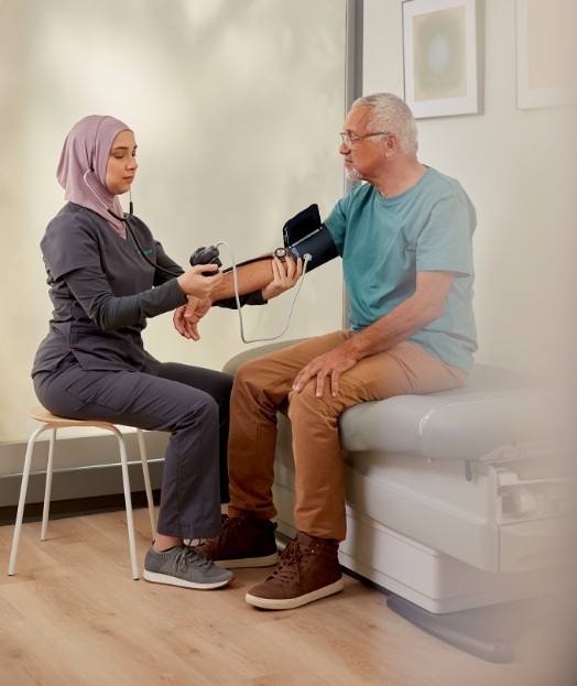 One Medical nurse taking a patient's blood pressure.