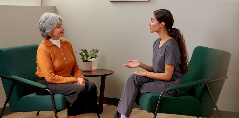 One Medical nurse speaking to a patient.