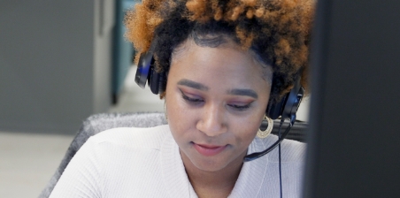 PatientPoint employee wearing a headset.