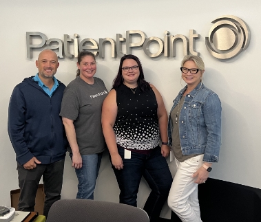  	A group of PatientPoint employees smiling.