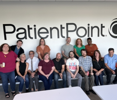  	A group of PatientPoint employees smiling.