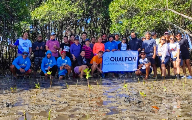 Qualfon team members posing in the Philippines as they work to provide relief efforts after Typhoon Odette.