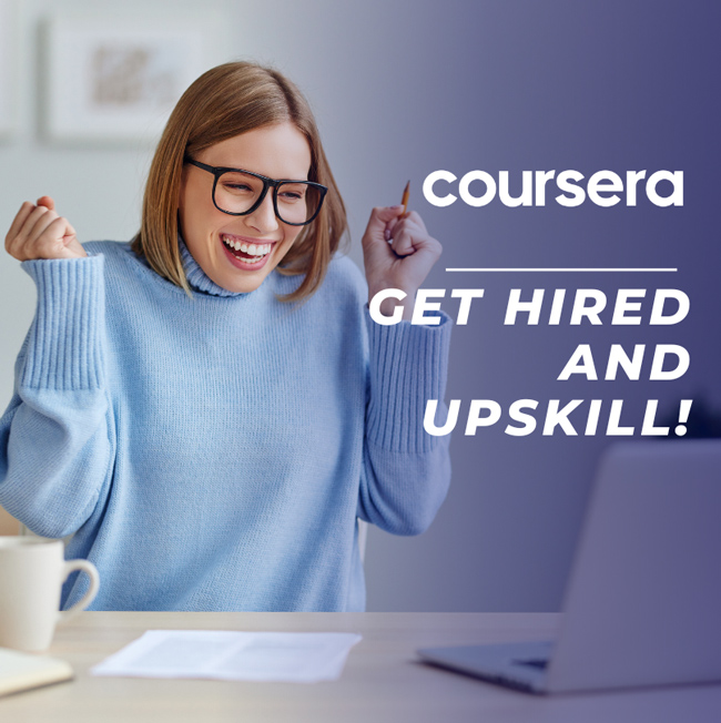 A woman smiling with excitement as she uses Coursera to Get Hired and Upskill.