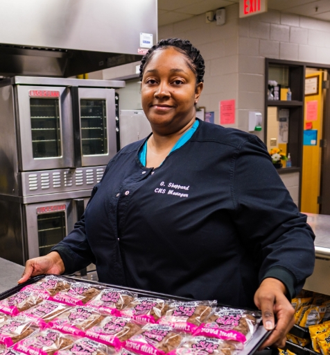 CNS manager serves pastries at Wake County Public School System
