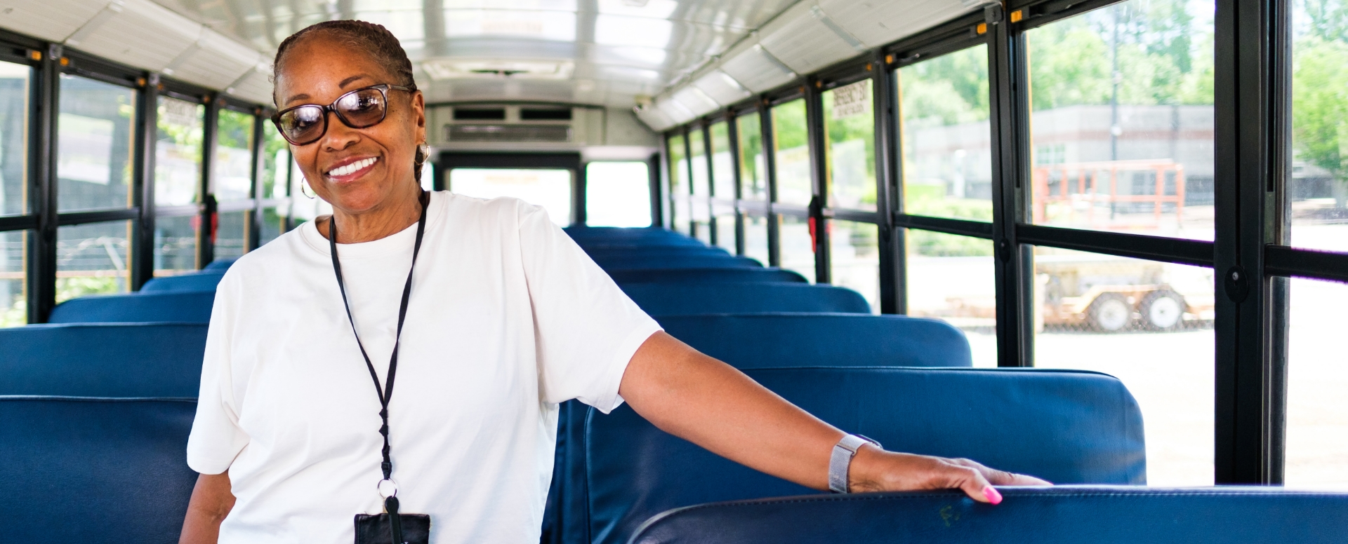 A Wake County Public School bus safety assistant smiling on the job.